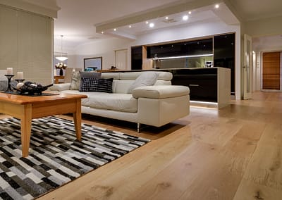 Living area connecting to kitchen with Oak timber flooring