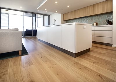 French Oak flooring with kitchen bench and open plan windows