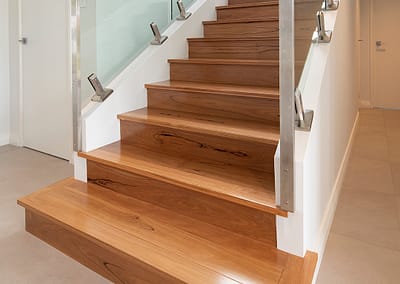 Bottom section of blackbutt timber staircase in Perth home