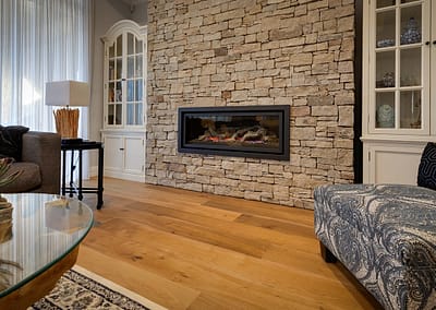 Smoked engineered oak flooring in front of fireplace
