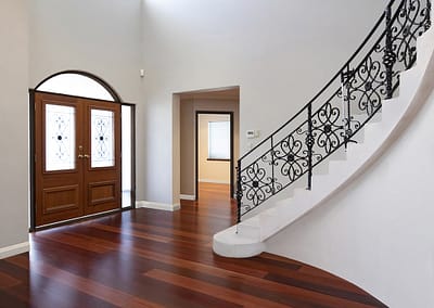 large stairwell in entrance of Perth home covered with Jarrah flooring